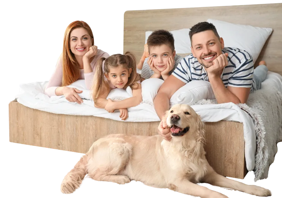 family-footer-homeopathy-at-home-homeopathic-online-courses-learn-homeopathy-natural-health-1 A smiling family with two young children and a golden retriever relaxing on a bed, reflecting warmth, harmony, and natural living with Homeopathy at Home.