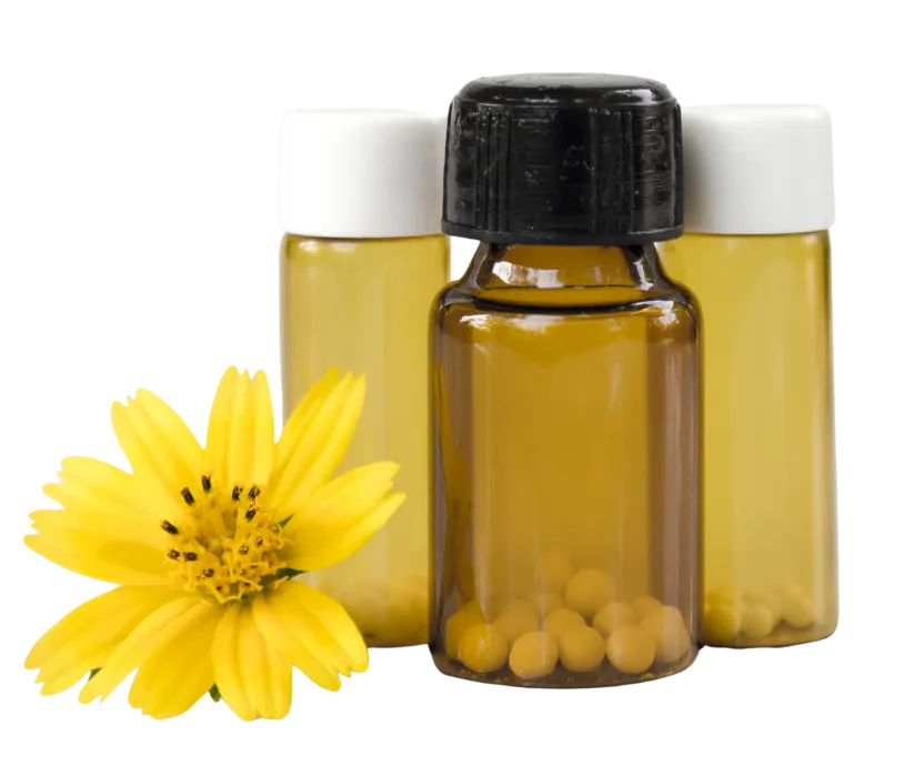 homeopathy-homeopathy-at-home-homeopathic-online-courses-learn-homeopathy-natural-health Amber glass bottles filled with homeopathic remedies alongside a bright yellow flower, highlighting natural healing with Homeopathy at Home.